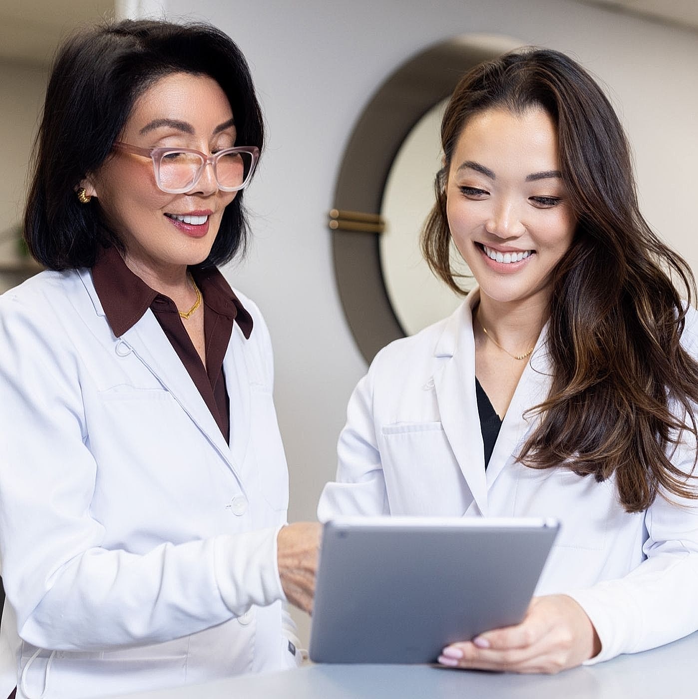 Dr. Jamie Yeo, DDS, and Dr. Rosita Tan, DMD – Marina del Ray dentists consulting together